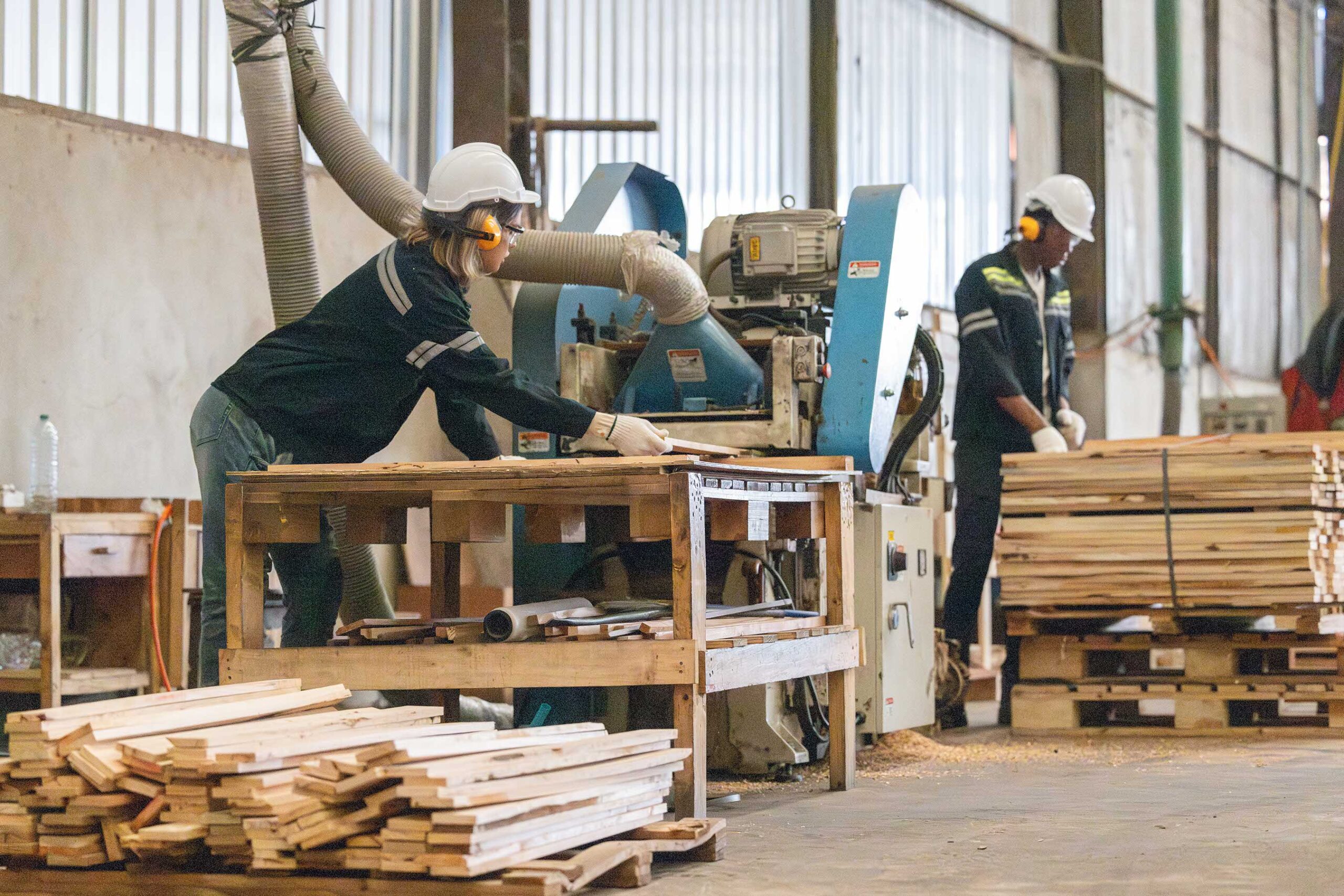 Wood turners operate a controller machine while tending a lathe to cut, shape, spin, polish, and balance wood and timber fixtures based on dimensions and needs. in the manufacturing process of wood.